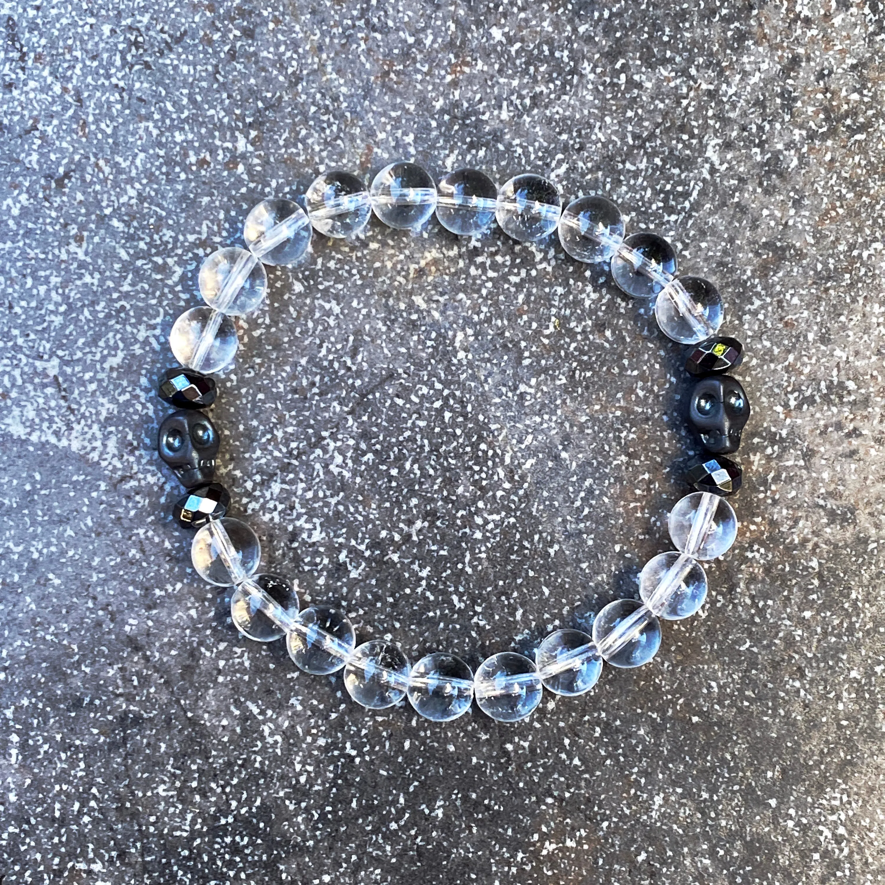 Clear Quartz gemstone and Hematite Skull Men’s Stretch Bracelet