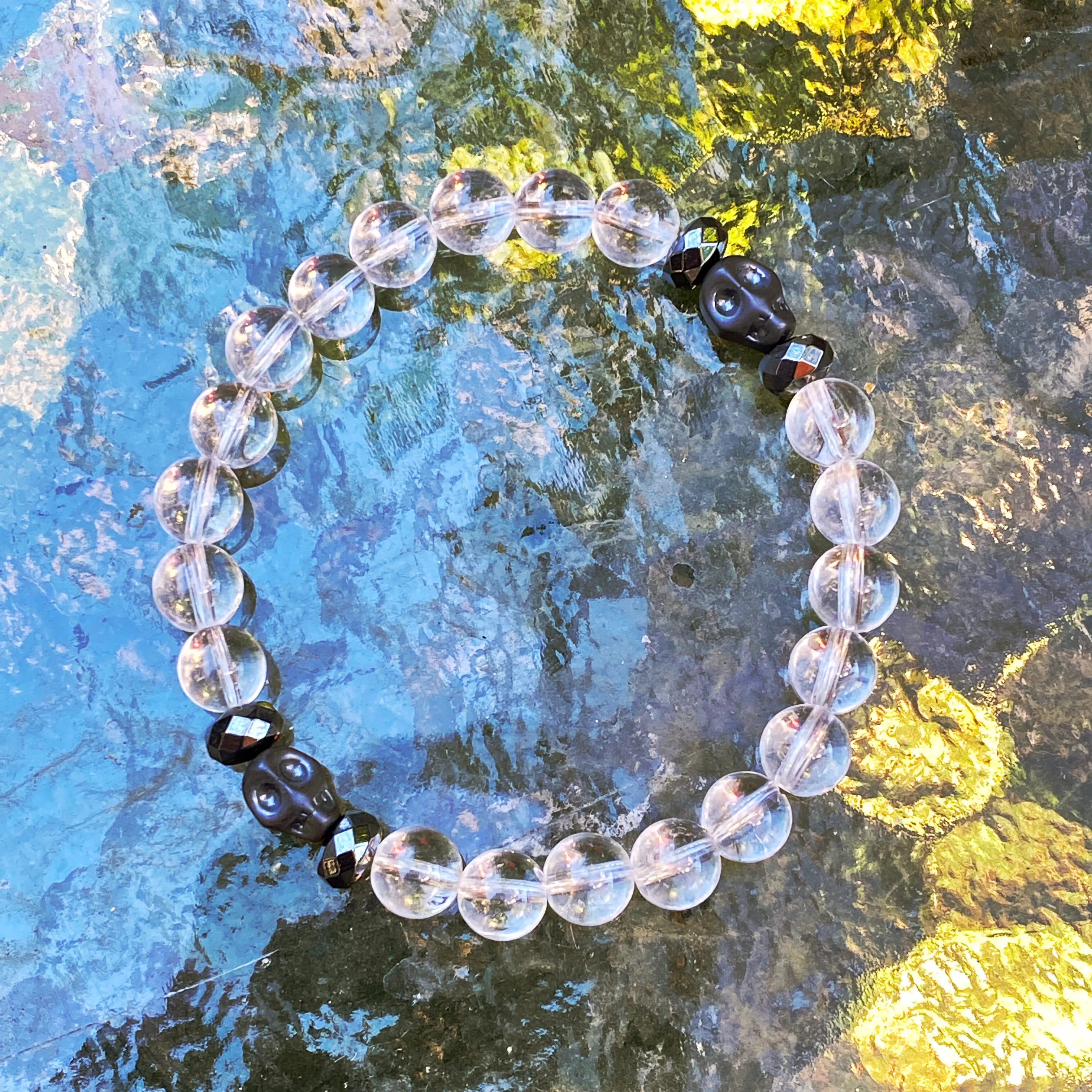 Clear Quartz gemstone and Hematite Skull Men’s Stretch Bracelet